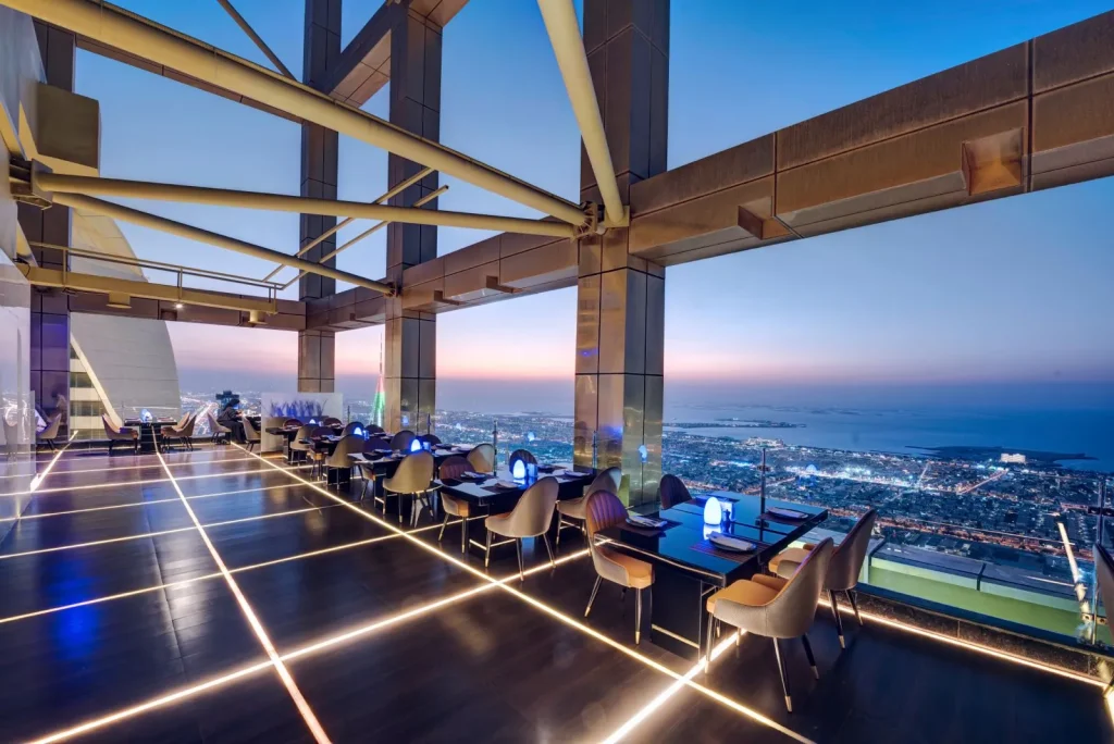 Highest View Lounge & Restaurant rooftop terrace at dusk with city and sea views, Gevora Hotel Dubai